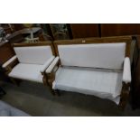 A pair of Victorian style mahogany and fabric upholstered settles