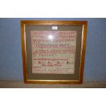 A Victorian sampler by Ellen Toft, framed