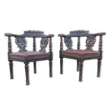 A pair of Victorian Jacobean Revival carved oak corner chairs
