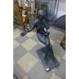 A large abstract bronze figure of a cellist