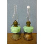 A pair of Victorian brass and celadon coloured glass oil lamps