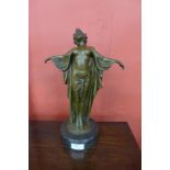 An Art Deco style bronze figure of a semi nude female, on black marble socle