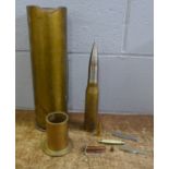 A military shell vase, one other shell and a bullet, penknives and a metal cylinder