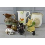 Two German jugs, a German vase, a Rumtopf pot, two model dogs, a Surrey Ceramics money box and a