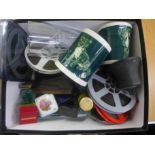 Assorted items including a bell, film reels, etc.