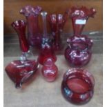 Nine items of Cranberry glass; five vases, a bell, a pot, an ashtray, etc.