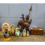 A set of Russian dolls depicting the Romanov family, a carved elephant figure, a/f and a musical box