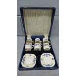A cased coffee set with six EPNS spoons, lacking one saucer