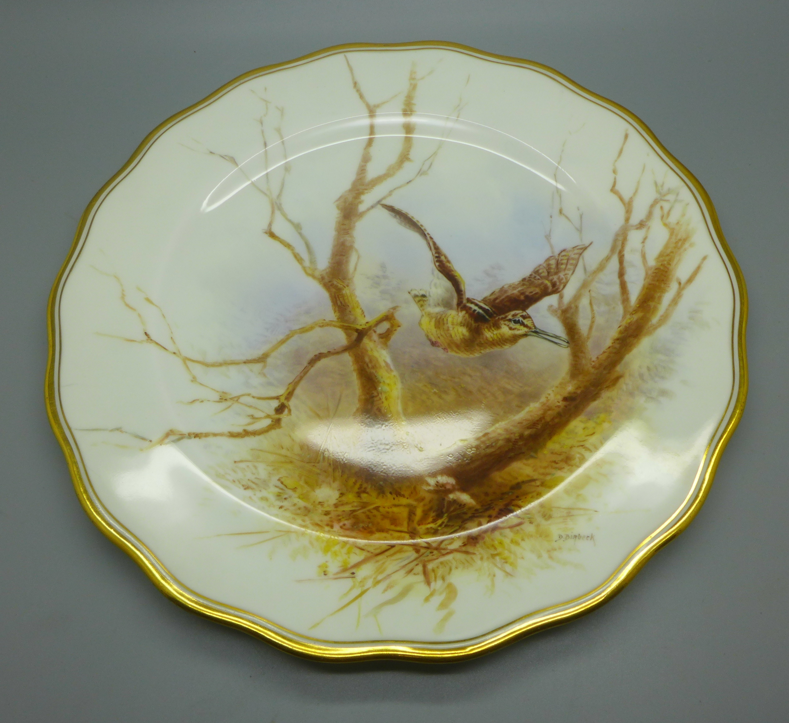 A Cauldon hand painted bird cabinet plate, with Woodcock decoration, signed D Birbeck, 23.5cm