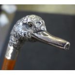 A walking cane with top in the form of a duck's head, silver hallmarks (rubbed)