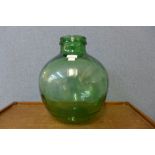 A small vintage green glass carboy