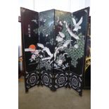 A Japanese black lacquered folding four panel dressing screen, a/f
