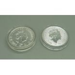 A Royal Mint silver £2 102 Valiant coin and a 2020 Britannia coin