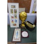 A papier mache gold figure, framed postcards, a vase, lion & cat figures