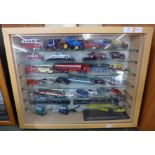 A display cabinet with die-cast model vehicles (approximately 42)