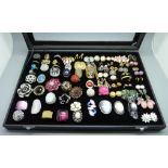 A large collection of dress rings and earrings