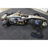 A Top-Hole model remote controlled racing car, missing battery pack