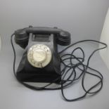A Bakelite telephone, marked AEP