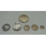 A Victorian silver shilling and five other silver coins, 35g