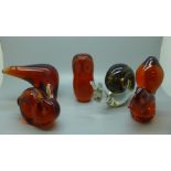 Five Wedgwood glass animal paperweights, four amber glass and one other