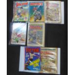 Eighteen bound vintage comics and four annuals, Victor and Hotspur