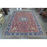 A hand knotted Persian red ground Tabriz rug, 390 x 315ms