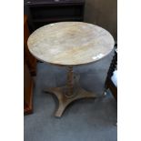 A Victorian oak circular tilt-top lamp table