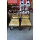 A set of four Regency carved mahogany dining chairs