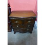 A George III style mahogany serpentine bachelors chest of drawers