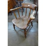 A Victorian elm and beech smokers bow chair