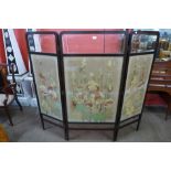 An Arts and Crafts mahogany and embroidered three panel folding dressing screen