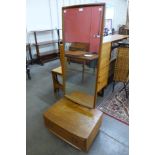 An Ercol elm cheval mirror