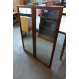 A pair of Danish teak framed mirrors