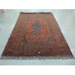 An eastern red ground rug, 300 x 202cms