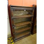 An early 20th Century Globe Wernicke oak four tier sectional stacking bookcase