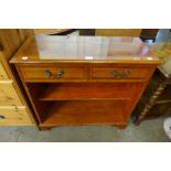 A small yew wood open bookcase