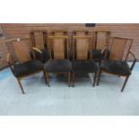 A set of eight G-Plan teak and bergere dining chairs