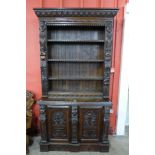 A Victorian Elizabethan Revival carved oak bookcase