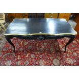 A French Louis XVI style ebonised and gilt metal mounted bureau plat