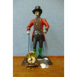 A German style painted metal figural timepiece