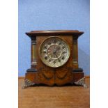 An early 20th Century continental faux walnut mantel clock, with Masonic presentation plaque