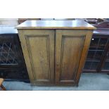 A Victorian pine two door kitchen cupboard