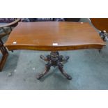 A Victorian mahogany serpentine side table