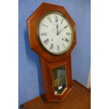 A mahogany wall clock