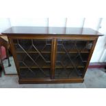 A George III style mahogany astragal glazed two door bookcase