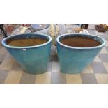 A pair of large turquoise glazed terracotta planters