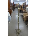 An early 20th Century brass floor standing lamp