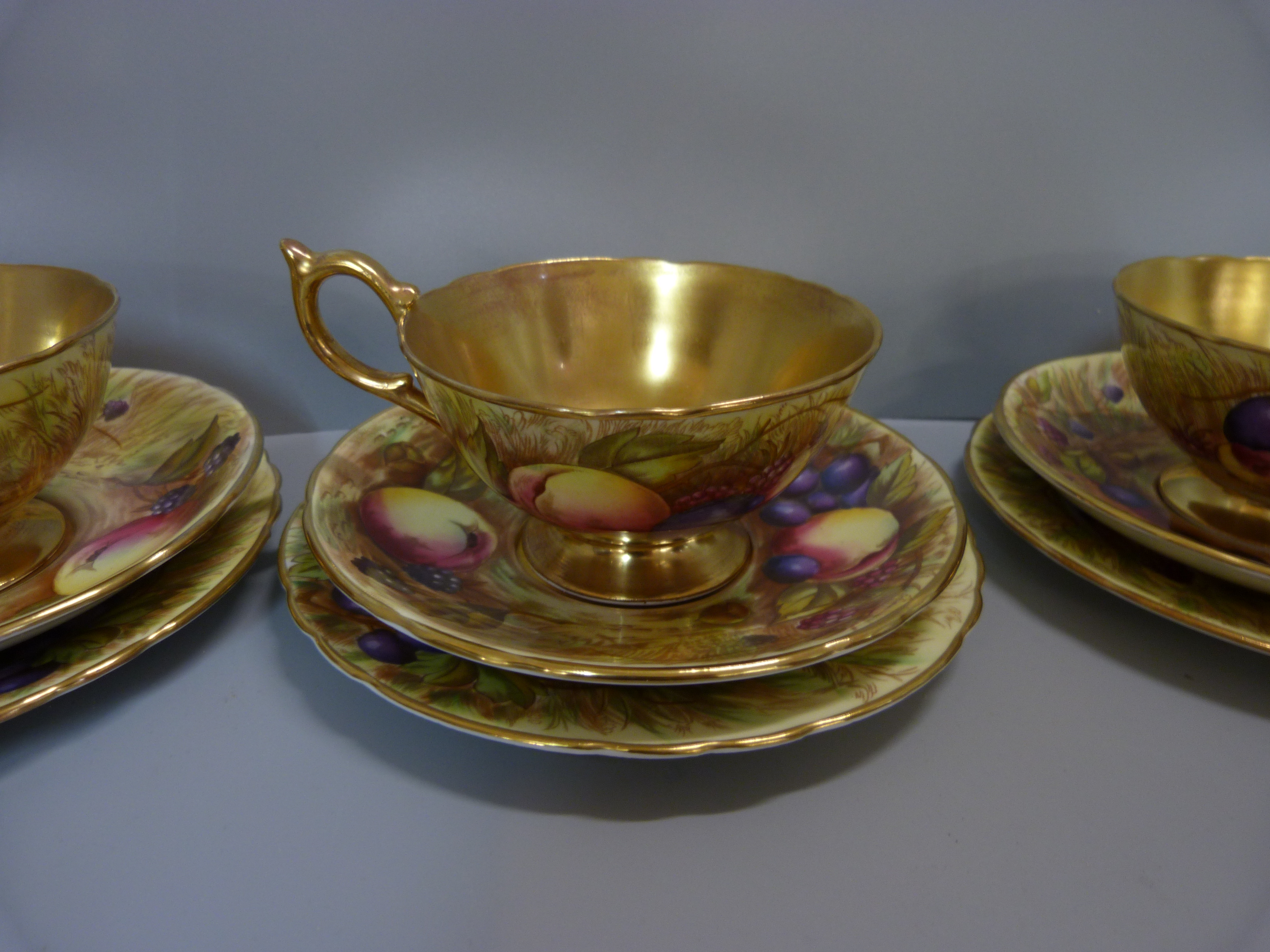 A set of six Aynsley cups, saucers and tea plates, decorated with fruit and berries in gold rim - Image 4 of 13