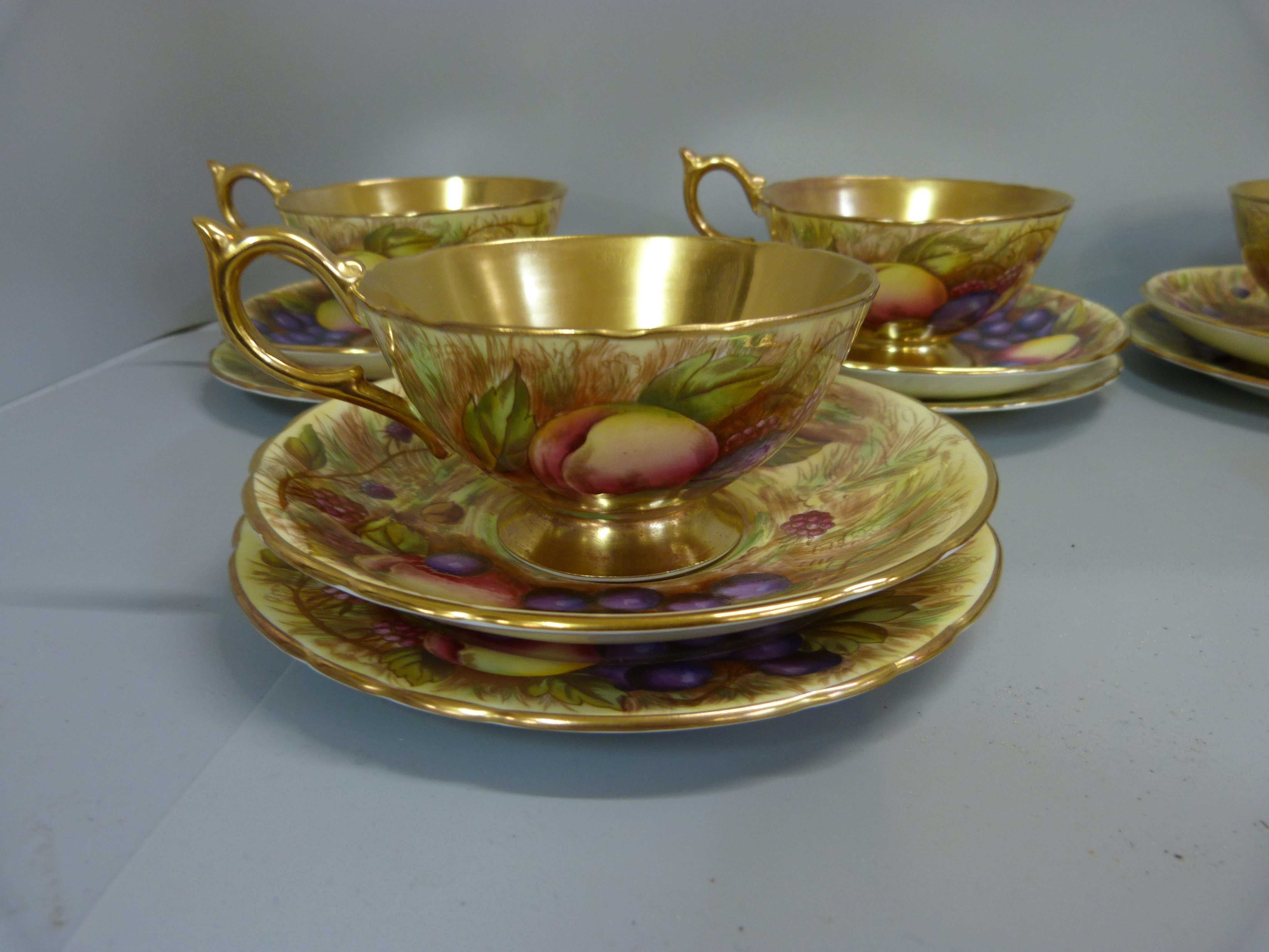 A set of six Aynsley cups, saucers and tea plates, decorated with fruit and berries in gold rim - Image 3 of 13