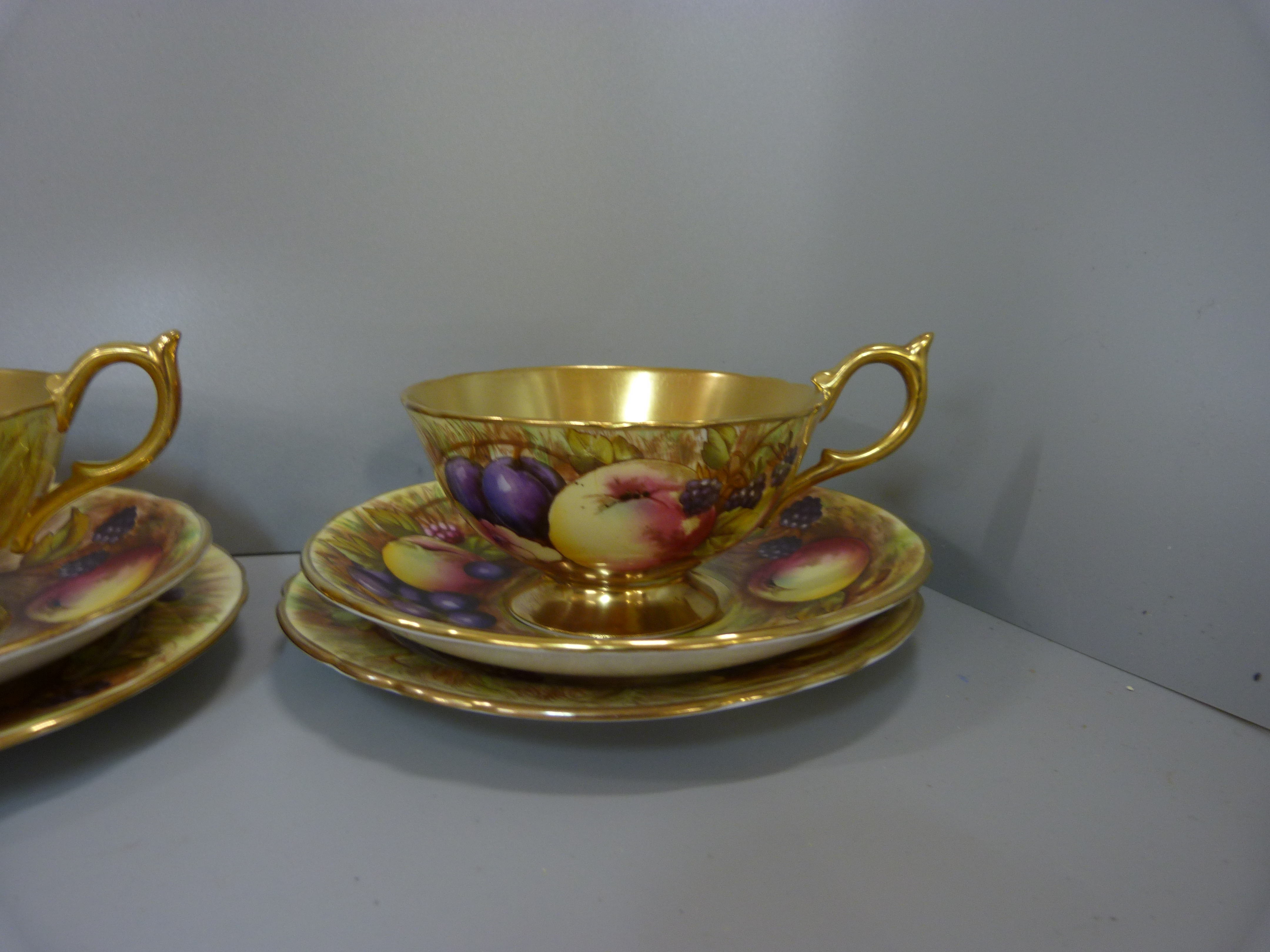 A set of six Aynsley cups, saucers and tea plates, decorated with fruit and berries in gold rim - Image 7 of 13